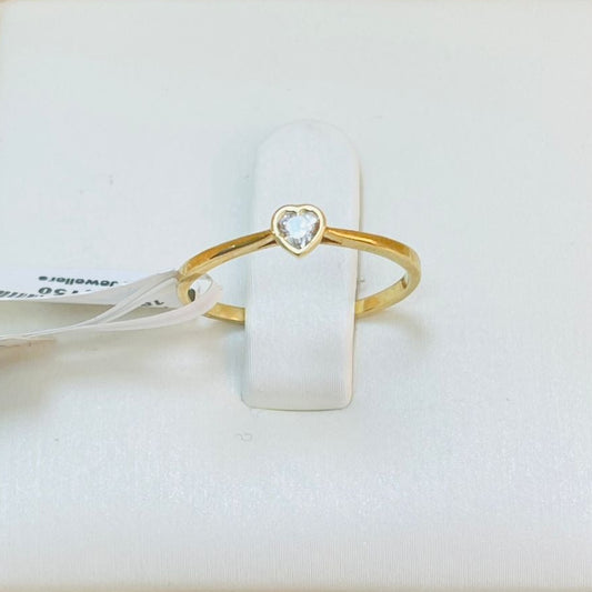 Gold ring with heart detail on a white box with product details.